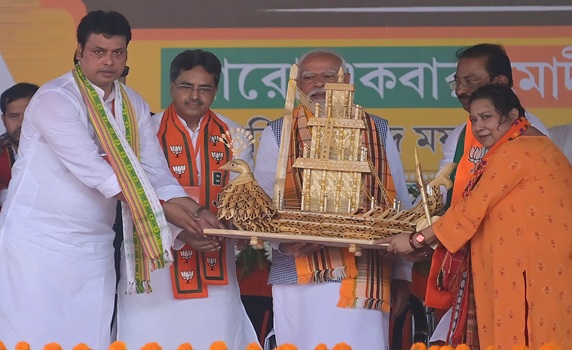 Prime Minister Narendra Modi was felicitated during a public rally ahead of the Lok Sabha Elections in Agartala. PIC- ABHISEK