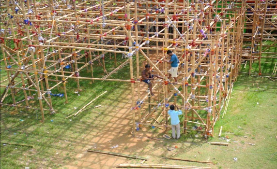 Workers are making a temporary bamboo structure, locally called "Pandel", for the upcoming Durga Puja in Agartala. PIC- ABHISEK 
