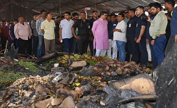 CM Dr. Manik Saha inspects the burnt vegetable market and talks with shop owners and vendors whose shops got burned last night in Battala market in Agartala.