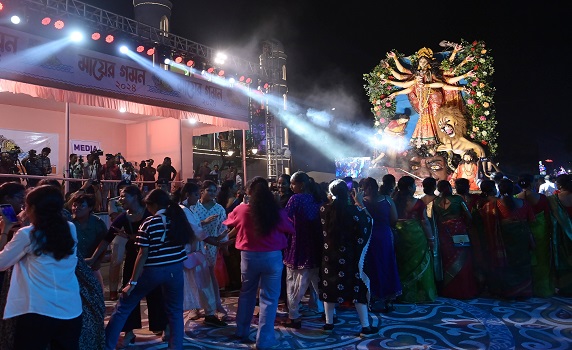 Devotees join Durga Puja Carnival in Agartala, immersing award-winning idols in Howrah River procession.