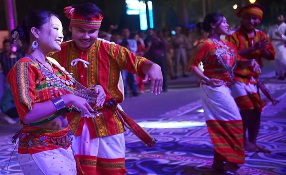 Artists perform with award-winning Durga idols at Tripura Carnival before immersion in Howrah River.