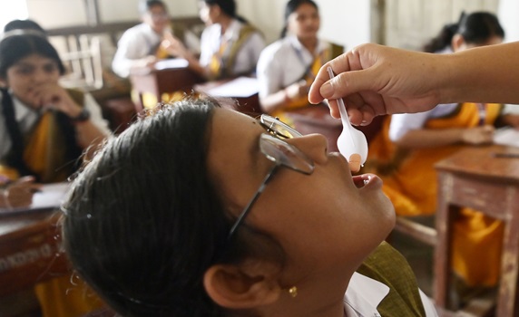 School teacher distributes deworming tablets at Agartala’s Netaji Subhash Vidyaniketan under MSSSKA 7.0 Health initiative. PIC - ABHISEK