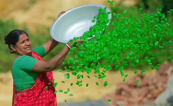 Worker dries finger fryums under the sun at Agartala factory, showcasing local food production. PIC- Abhisek 