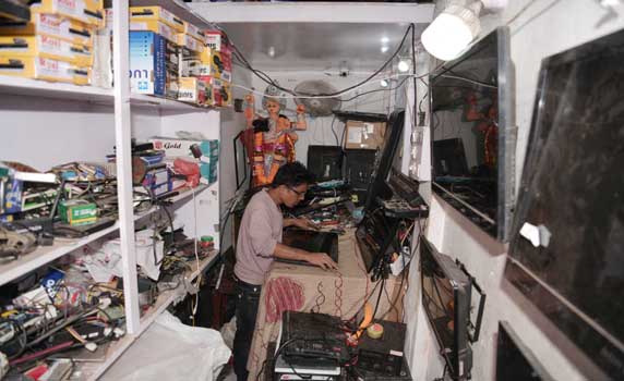 A mechanic is repairing a TV (television) in his workshop on World Television Day at Agartala. In December 1996 the United Nations proclaimed 21 November as World Television Day. Pic Abhisek Saha
