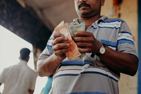 indian rupee slips to all-time low on outflow worries