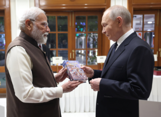 PM Modi Gifts Russian Bhagavad Gita to Putin During Visit PM Modi Gifts Russian Bhagavad Gita to Putin During Visit