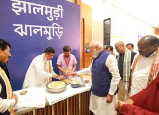 Bengal CM Adhikari Offers Bengali Snack to PM Modi Bengal CM Adhikari Offers Bengali Snack to PM Modi